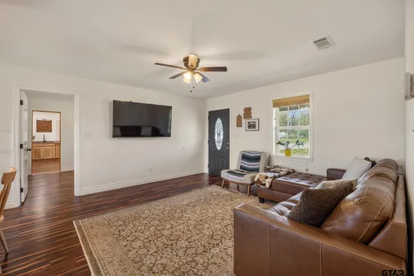 a kitchen with stainless steel appliances a refrigerator and a stove top oven
