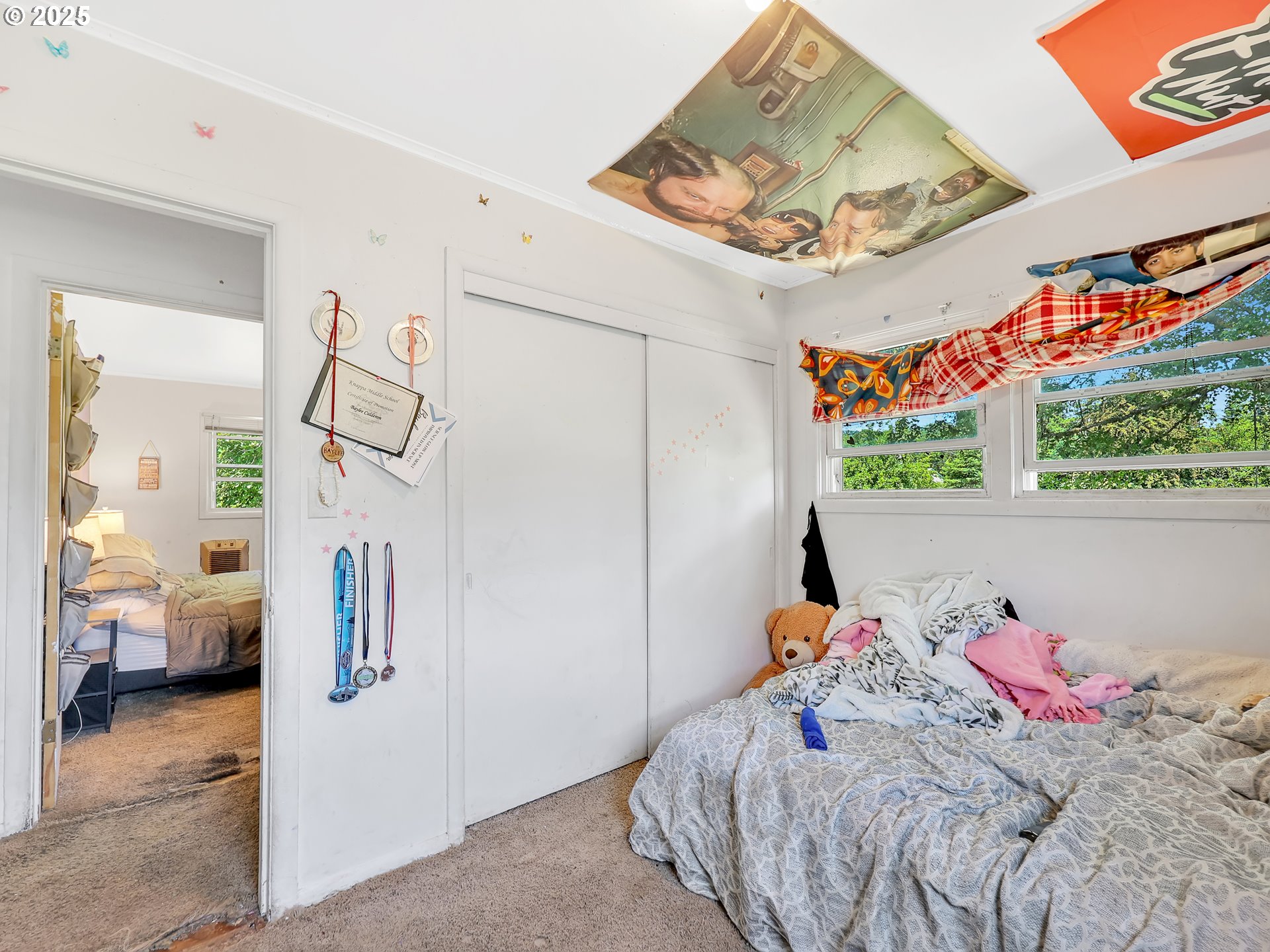 43018 Hillcrest Loop Astoria, OR 97103 - Photo 20 of 27 a bedroom with a bed and a window