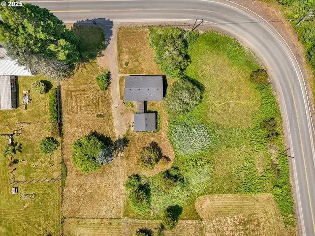 an aerial view of a swimming pool and mountain view in back