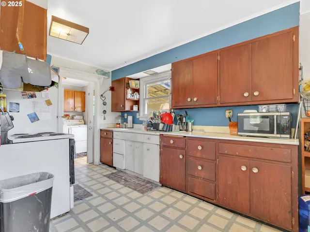 a kitchen with sink cabinets and window