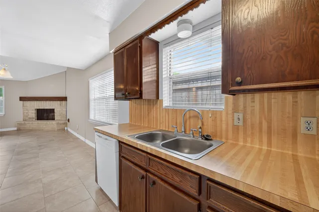 a kitchen with a sink and cabinets