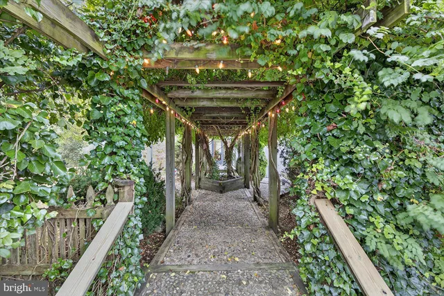 a view of a hallway with wooden floor and a fireplace