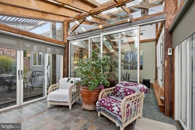 a bedroom with a bed and a workspace