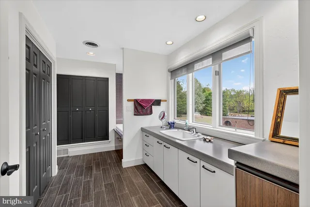 an aerial view of a house with a yard table and chairs
