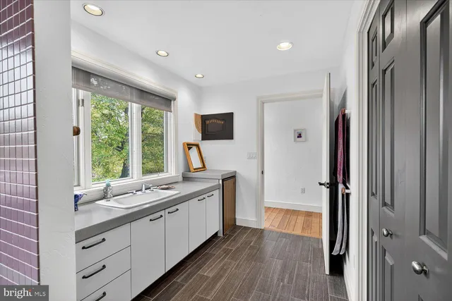 an aerial view of a house with a yard and lake view