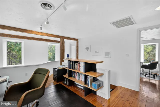 a view of a lake with a floor to ceiling window