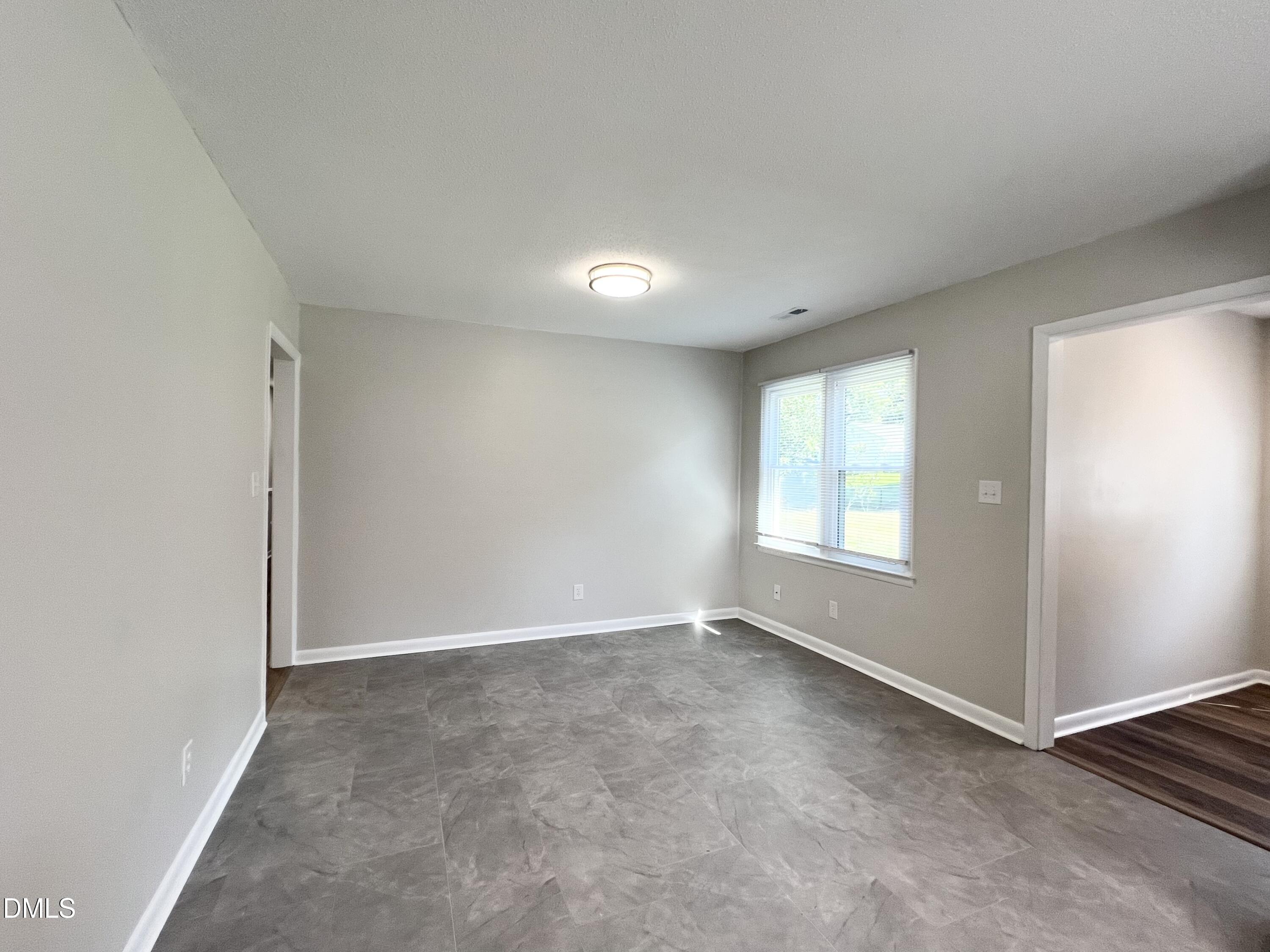 200 Infinity Road Durham, NC 27712 - Photo 11 of 32 an empty room with windows