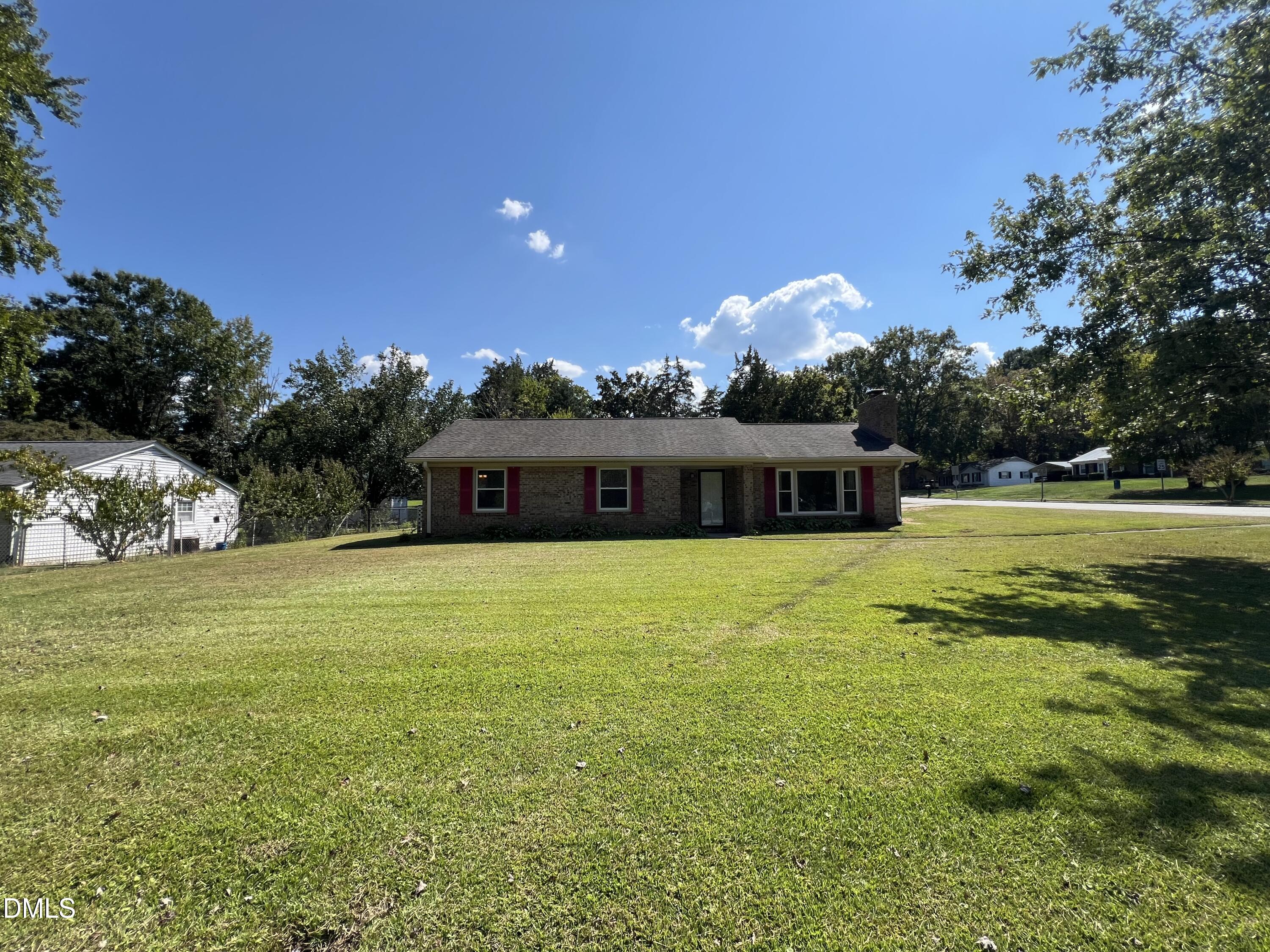 200 Infinity Road Durham, NC 27712 - Photo 2 of 32 a front view of a house with a garden