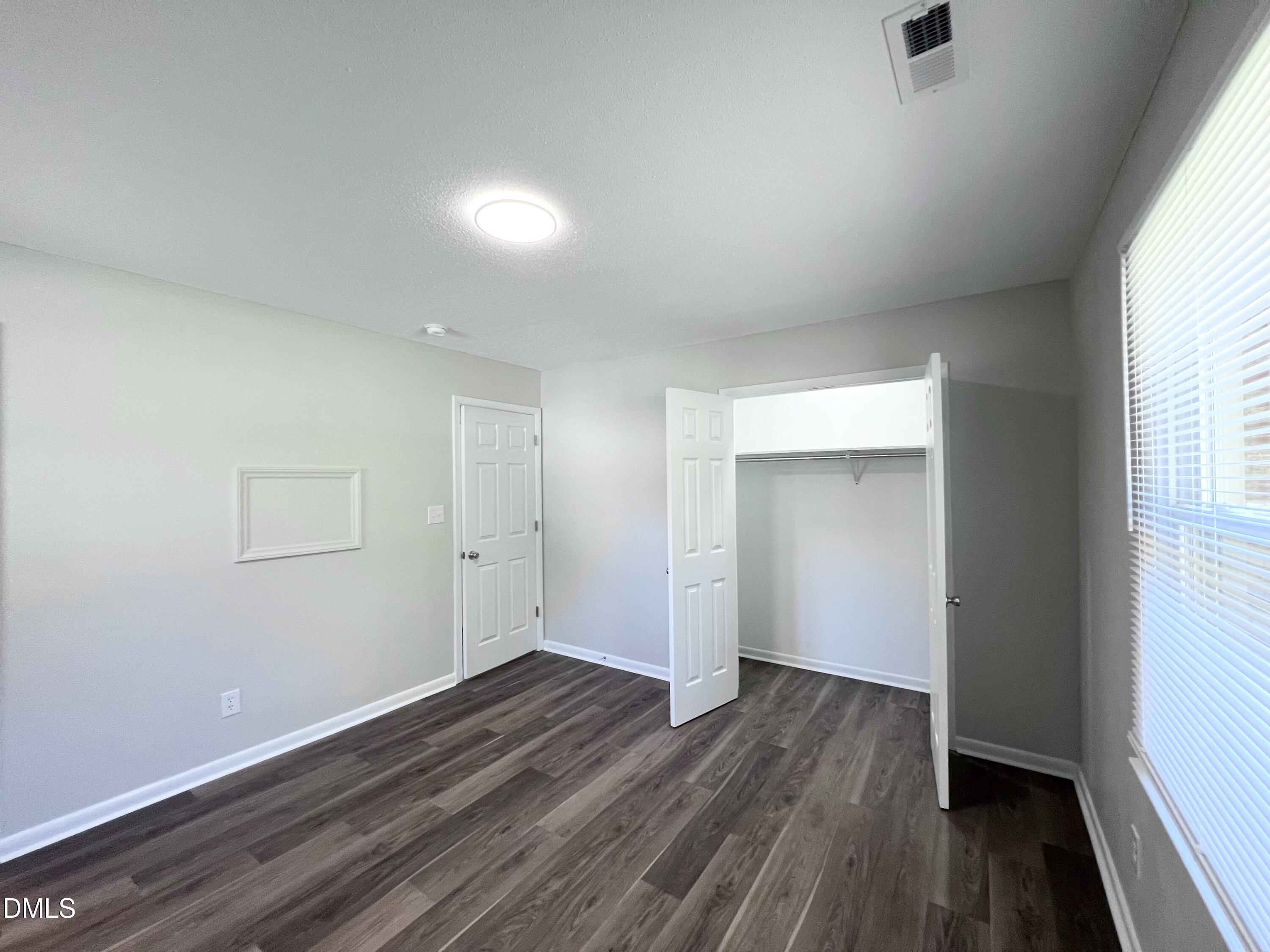 200 Infinity Road Durham, NC 27712 - Photo 26 of 32 wooden floor in an empty room with a window