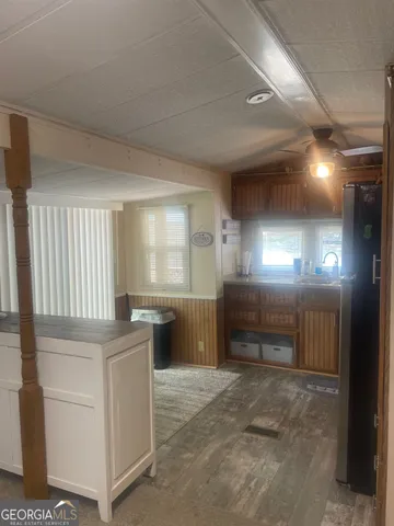 a kitchen with granite countertop a stove and a cabinet