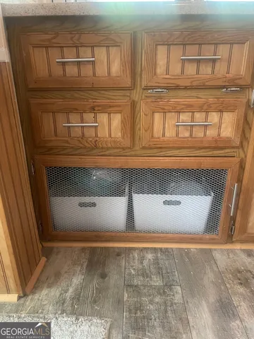 a kitchen with stainless steel appliances kitchen island granite countertop a stove and a refrigerator