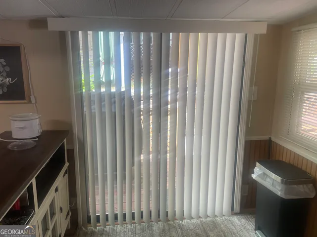 a kitchen with stainless steel appliances granite countertop a refrigerator and a stove