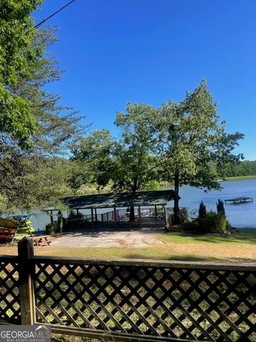 a front view of house with a garden