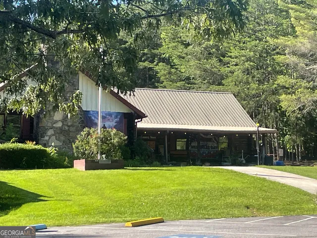 a wooden bench sitting next to a yard