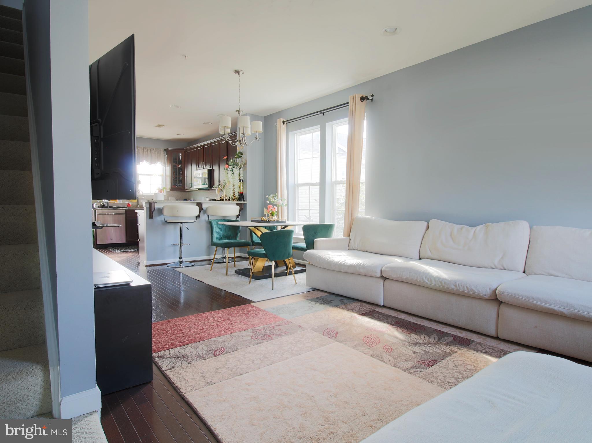 7465 Riding Meadow Way, Unit 42 Manassas, VA 20111 - Photo 12 of 26 a living room with furniture and a large window
