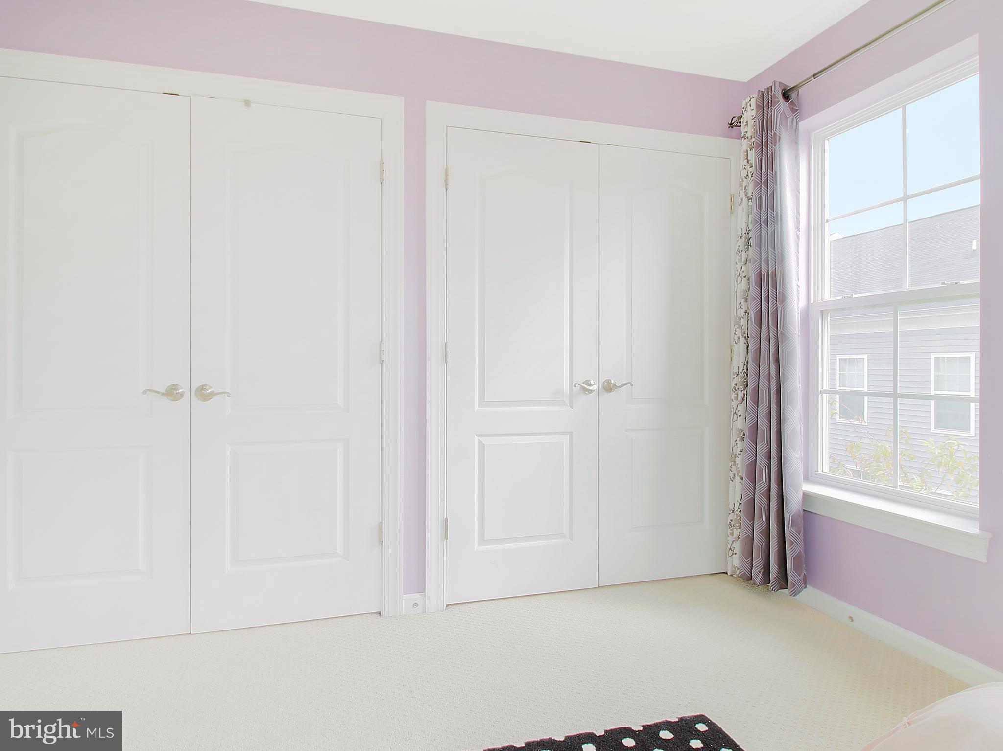 7465 Riding Meadow Way, Unit 42 Manassas, VA 20111 - Photo 21 of 26 a view of an empty room with a window