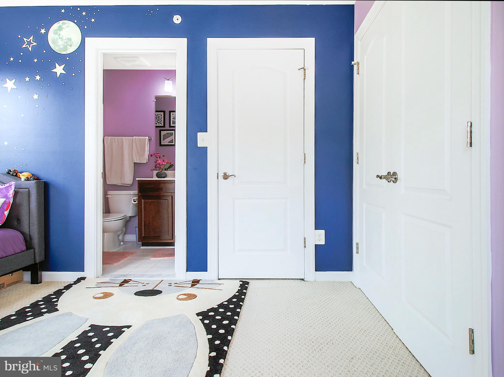 7465 Riding Meadow Way, Unit 42 Manassas, VA 20111 - Photo 22 of 26 a bedroom with a bed and a dresser in it