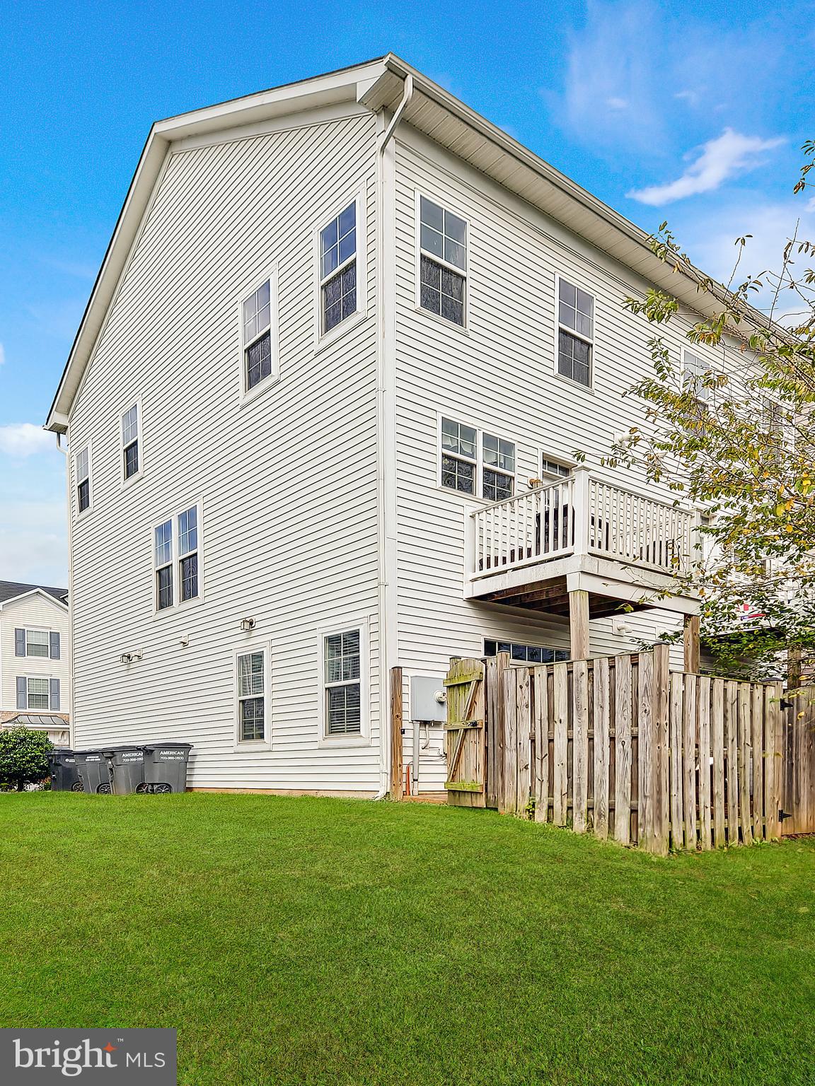7465 Riding Meadow Way, Unit 42 Manassas, VA 20111 - Photo 26 of 26 a front view of a house with a garden