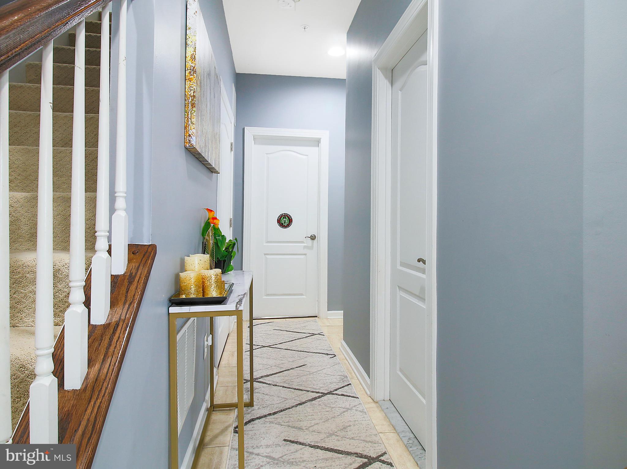 7465 Riding Meadow Way, Unit 42 Manassas, VA 20111 - Photo 6 of 26 a view of an entryway with wooden floor