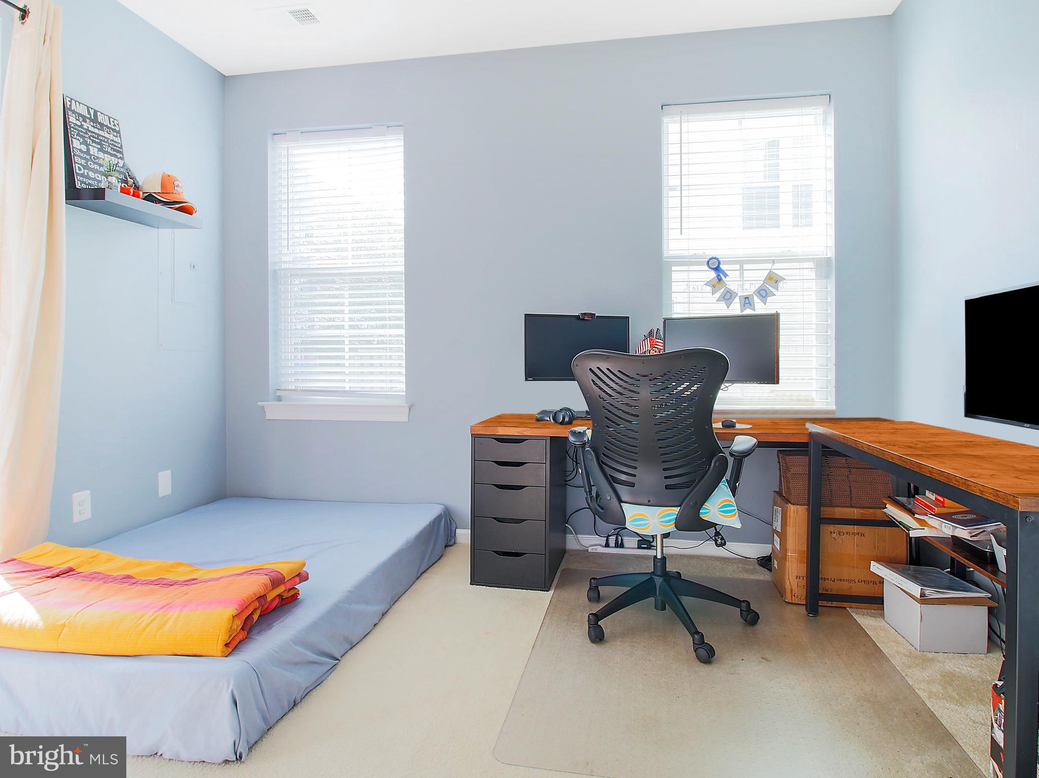 7465 Riding Meadow Way, Unit 42 Manassas, VA 20111 - Photo 10 of 26 a living room with furniture and a window