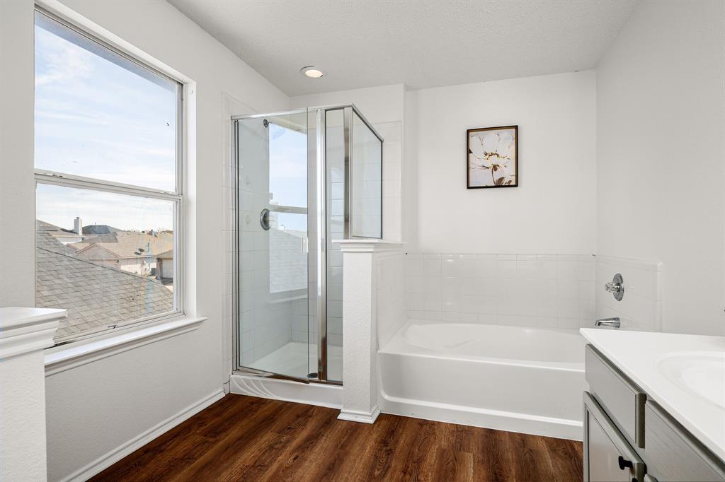 4816 Star Ridge Drive Fort Worth, TX 76133 - Photo 15 of 23 a bathroom with a bathtub and a shower