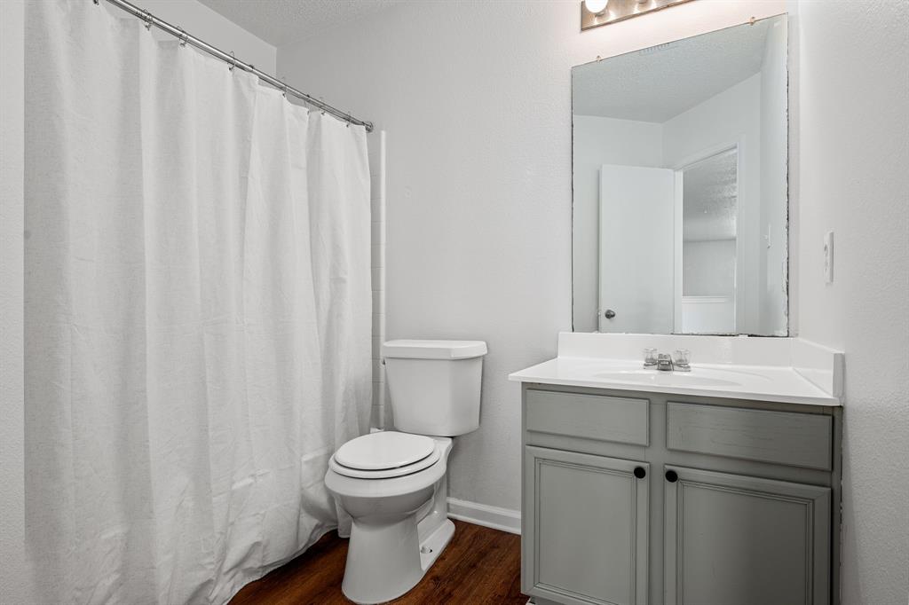 4816 Star Ridge Drive Fort Worth, TX 76133 - Photo 17 of 23 a bathroom with a sink a toilet and shower