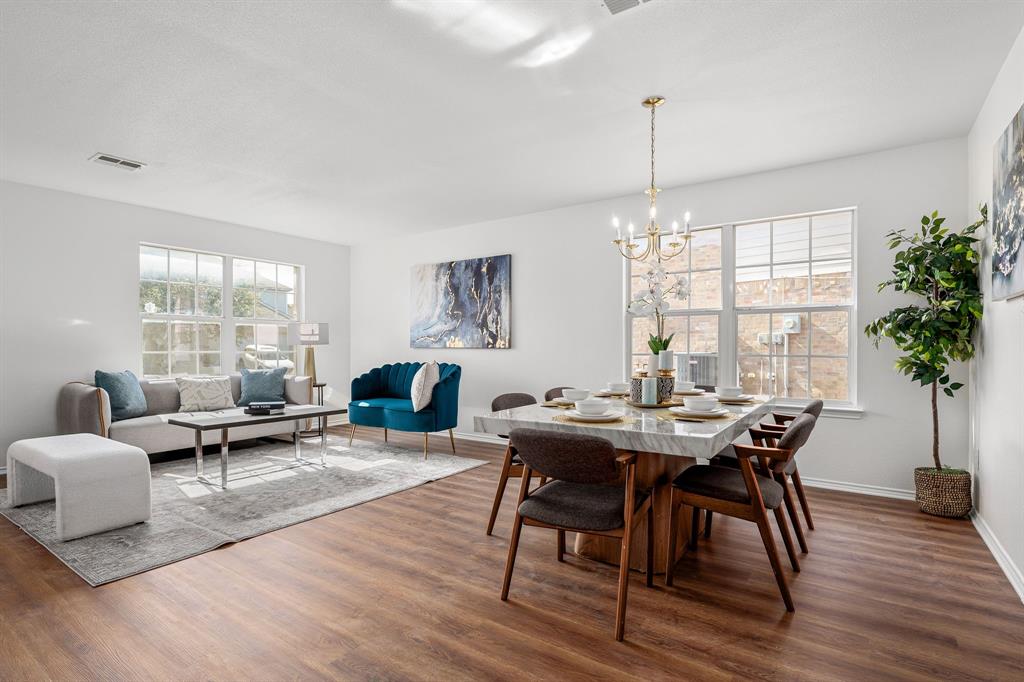 4816 Star Ridge Drive Fort Worth, TX 76133 - Photo 4 of 23 a view of a dining room with furniture window and wooden floor