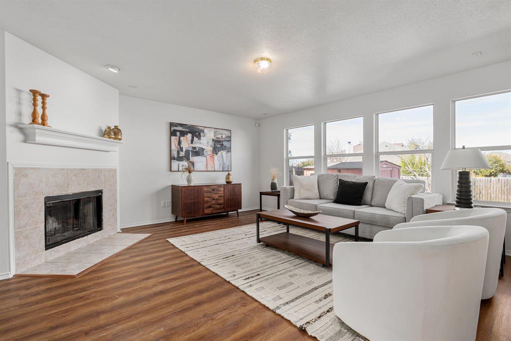 4816 Star Ridge Drive Fort Worth, TX 76133 - Photo 5 of 23 a living room with furniture and a fireplace
