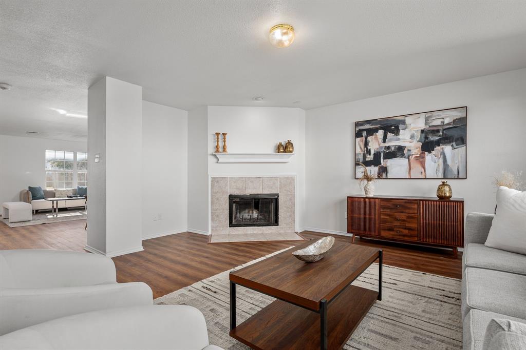 4816 Star Ridge Drive Fort Worth, TX 76133 - Photo 6 of 23 a living room with furniture and a fireplace