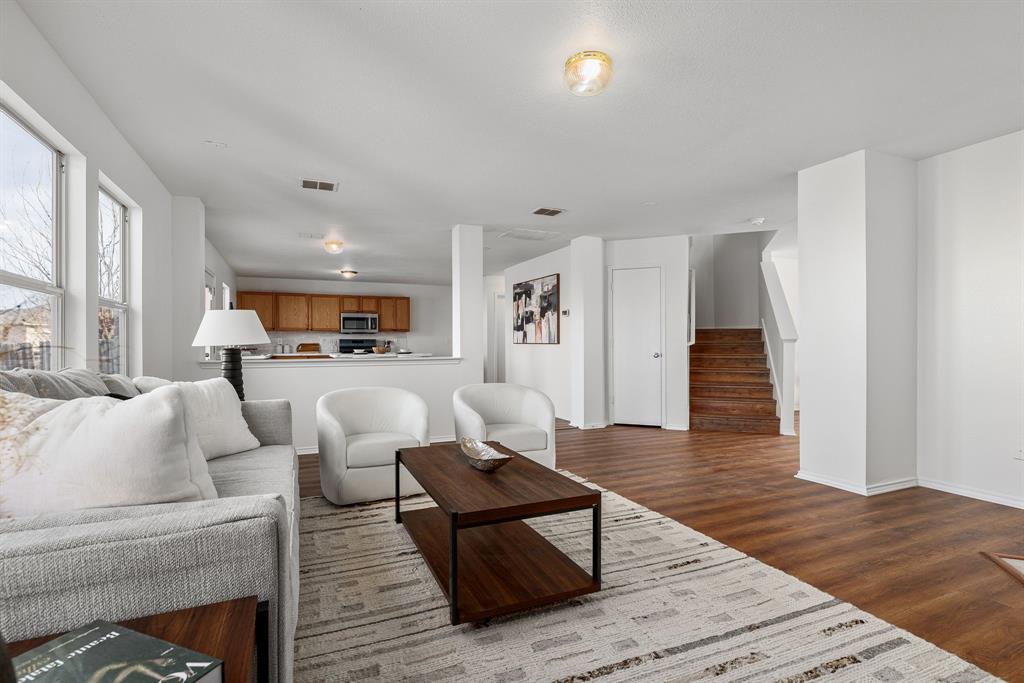 4816 Star Ridge Drive Fort Worth, TX 76133 - Photo 7 of 23 a living room with furniture and a wooden floor