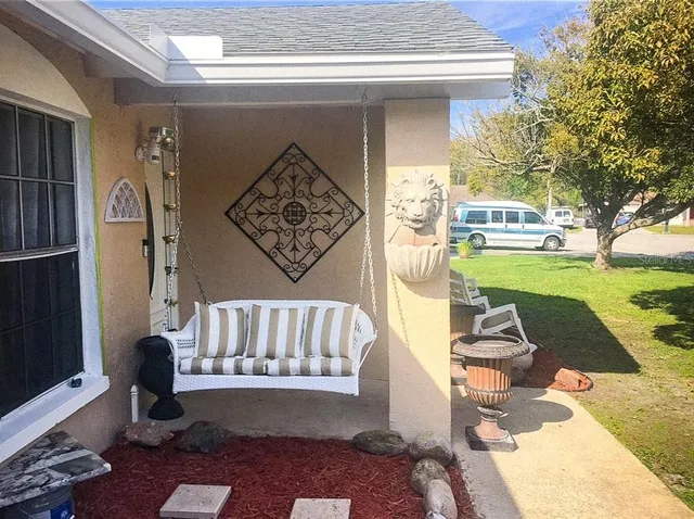 a view of porch with seating area