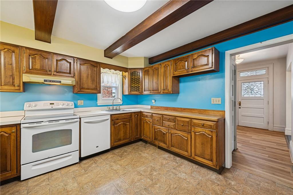 618 State Street Greensburg, PA 15601 - Photo 11 of 34 a kitchen with granite countertop a sink cabinets stainless steel appliances and a window