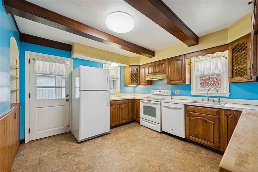 618 State Street Greensburg, PA 15601 - Photo 12 of 34 a kitchen with refrigerator and cabinets