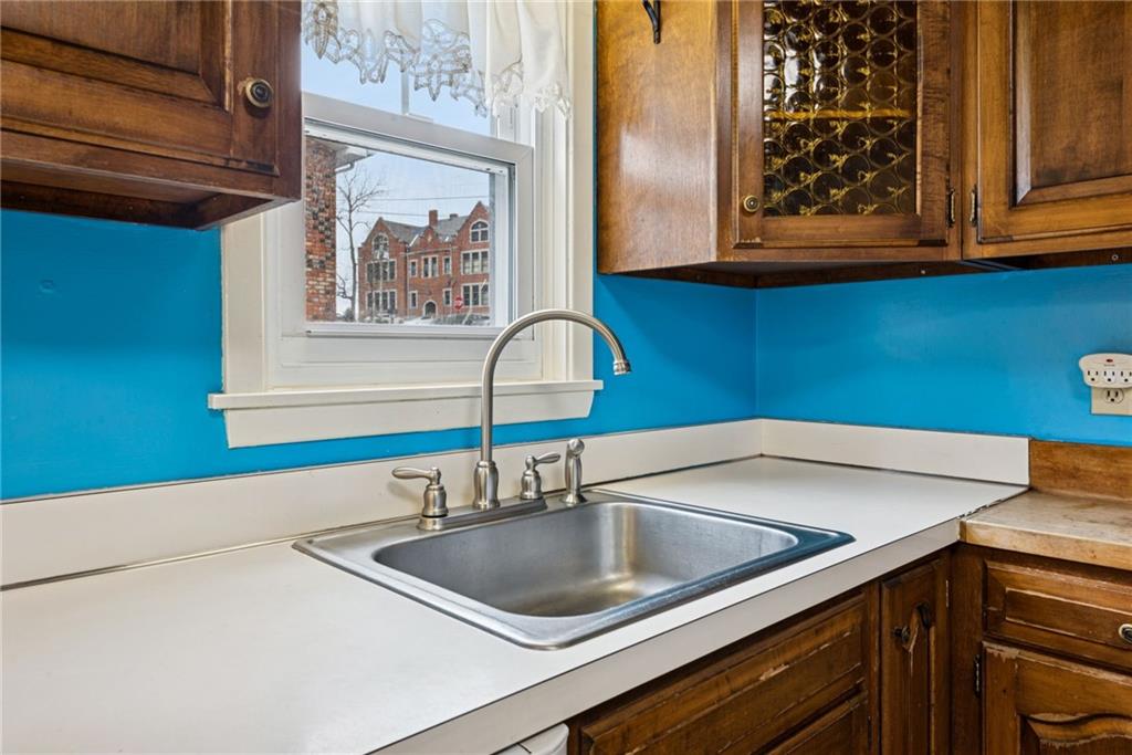 618 State Street Greensburg, PA 15601 - Photo 14 of 34 a kitchen with a sink cabinets and a wooden floor