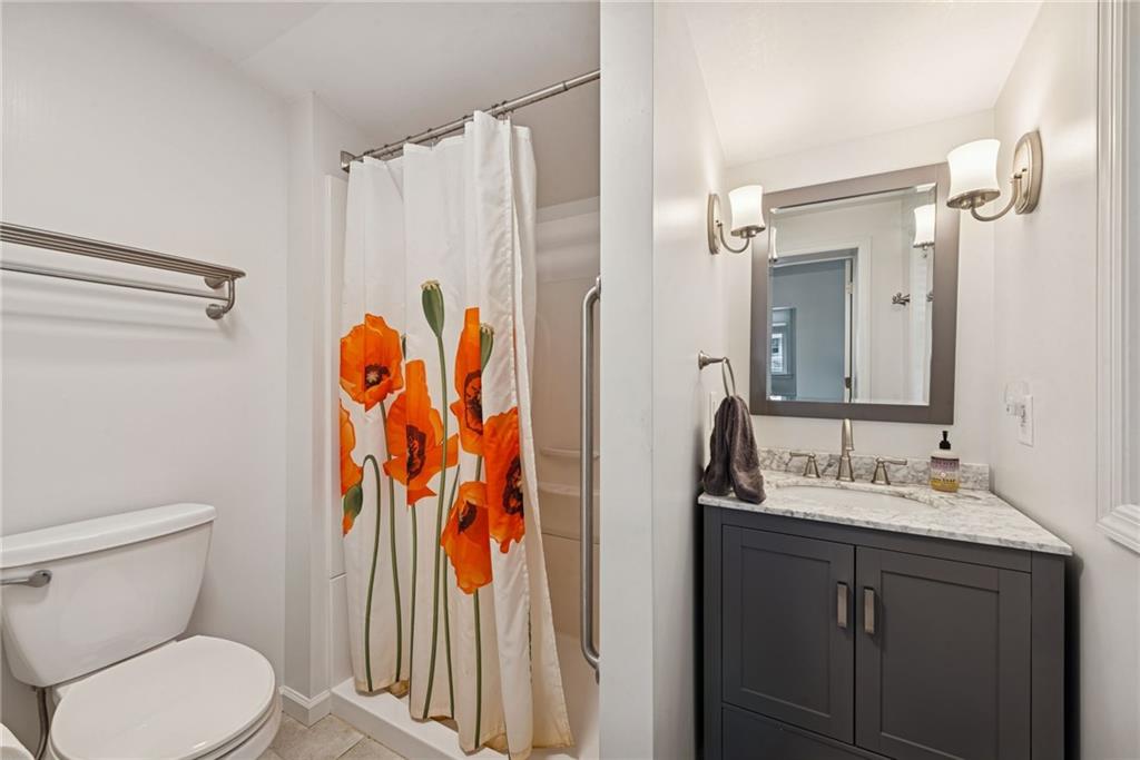 618 State Street Greensburg, PA 15601 - Photo 15 of 34 a bathroom with a sink and a mirror