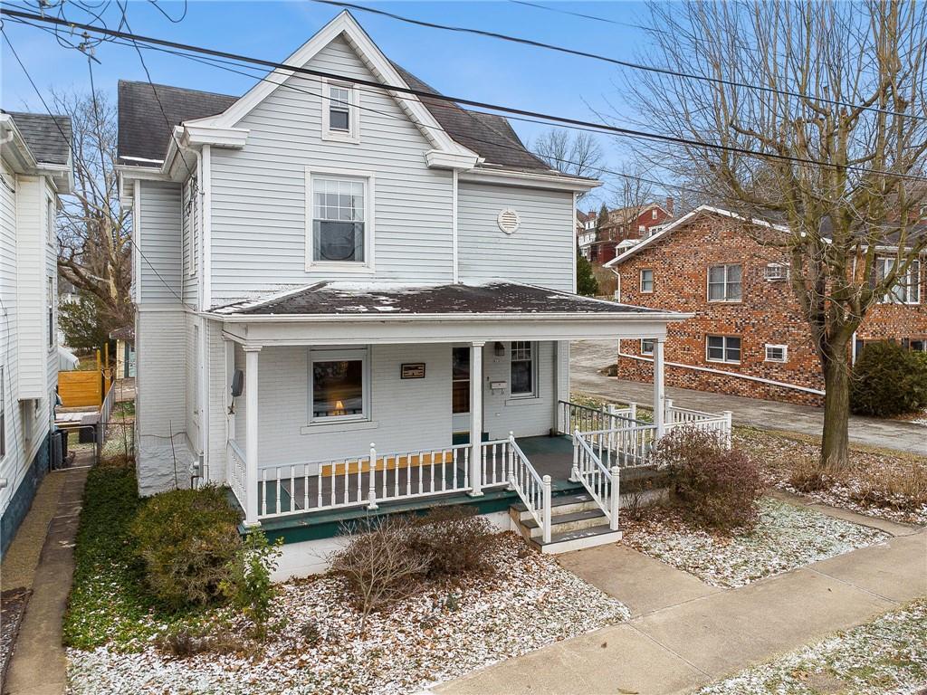 618 State Street Greensburg, PA 15601 - Photo 2 of 34 a view of a house with a yard and lawn chairs