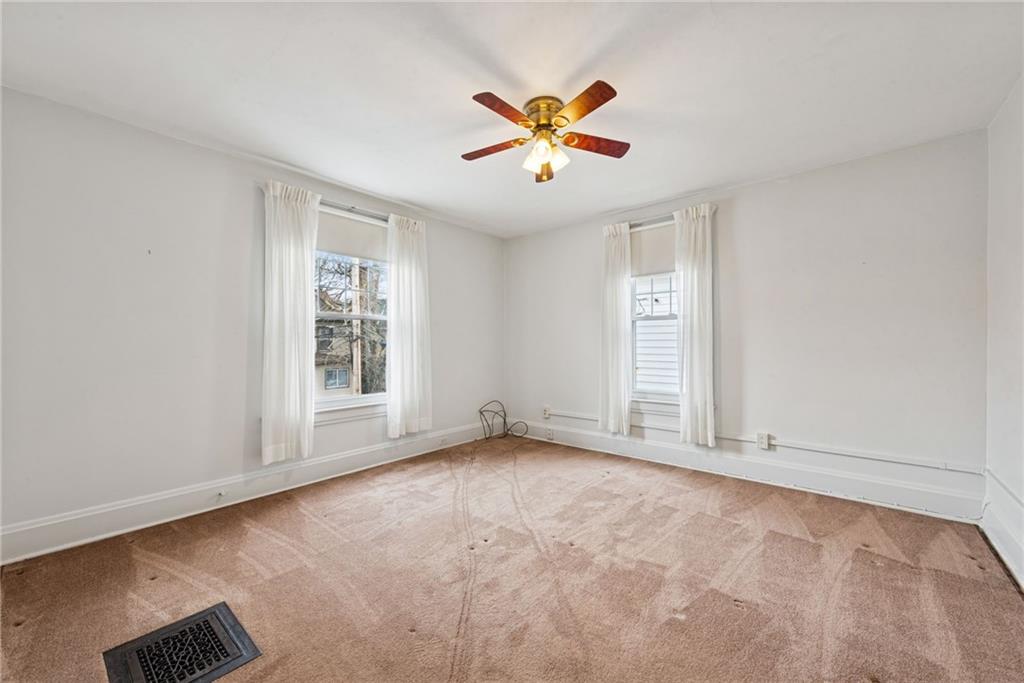 618 State Street Greensburg, PA 15601 - Photo 22 of 34 an empty room with window and ceiling fan