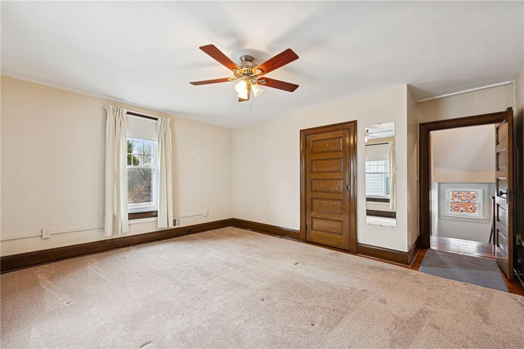 618 State Street Greensburg, PA 15601 - Photo 23 of 34 a view of a livingroom with a ceiling fan and window