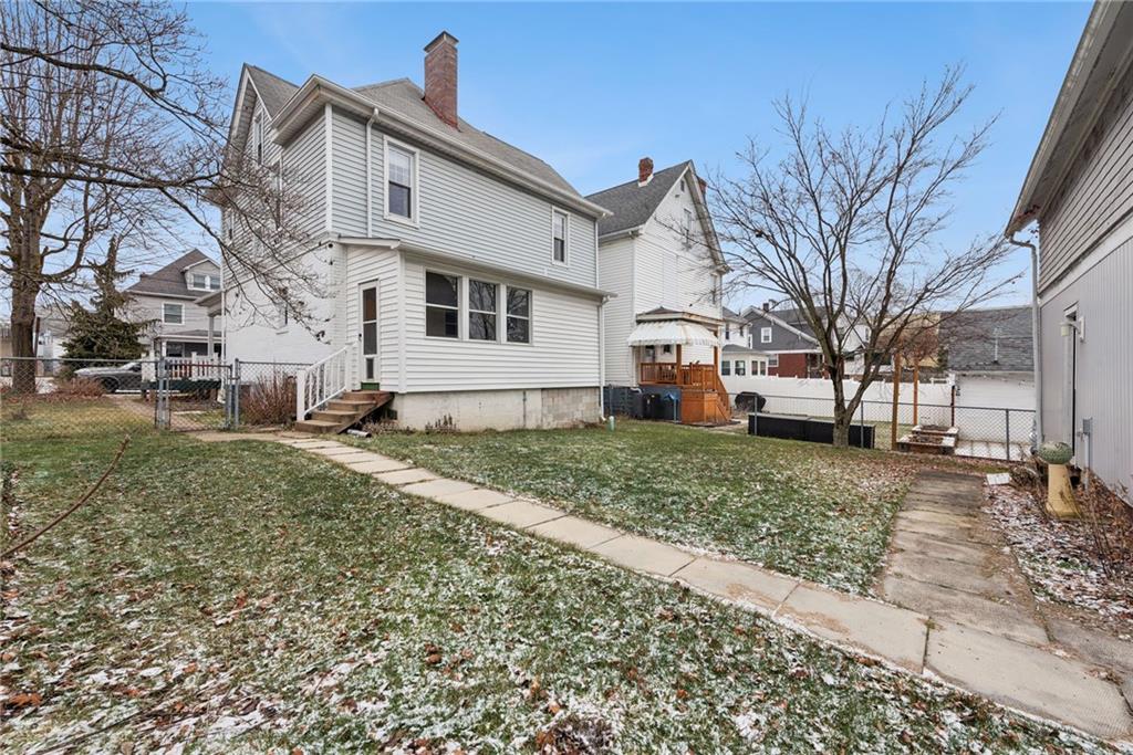 618 State Street Greensburg, PA 15601 - Photo 26 of 34 a view of a white house next to a yard with large trees