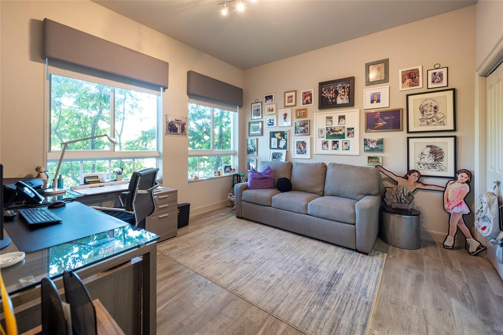 16102 Emerald Estates Drive, Unit 207 Weston, FL 33331 - Photo 12 of 32 a living room with furniture and large windows