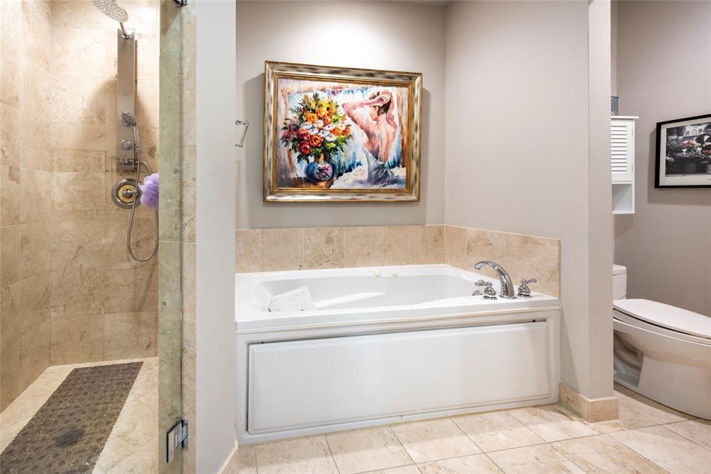 16102 Emerald Estates Drive, Unit 207 Weston, FL 33331 - Photo 16 of 32 a bathroom with a bathtub and a shower