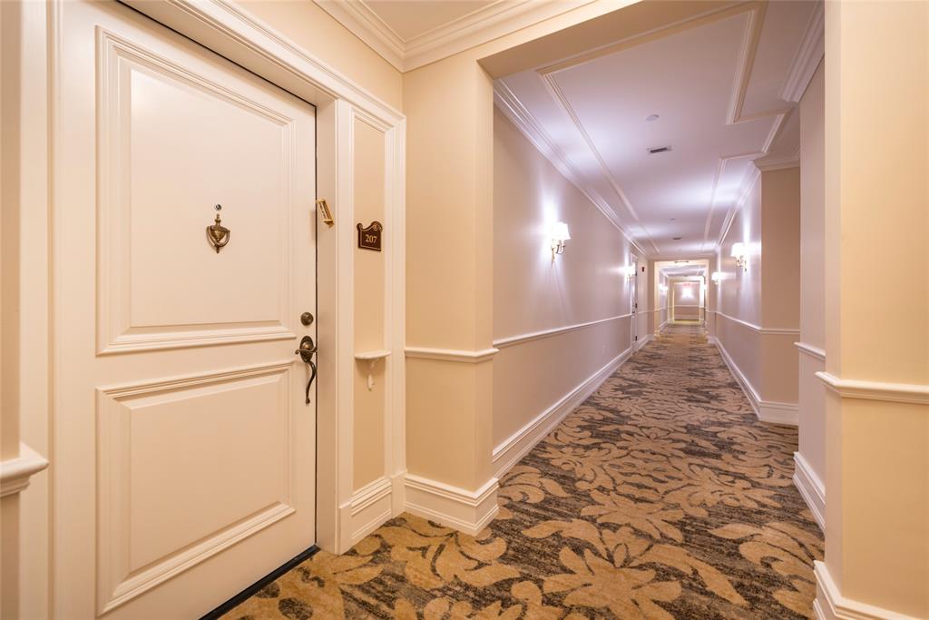 16102 Emerald Estates Drive, Unit 207 Weston, FL 33331 - Photo 19 of 32 a view of a hallway with wooden floor