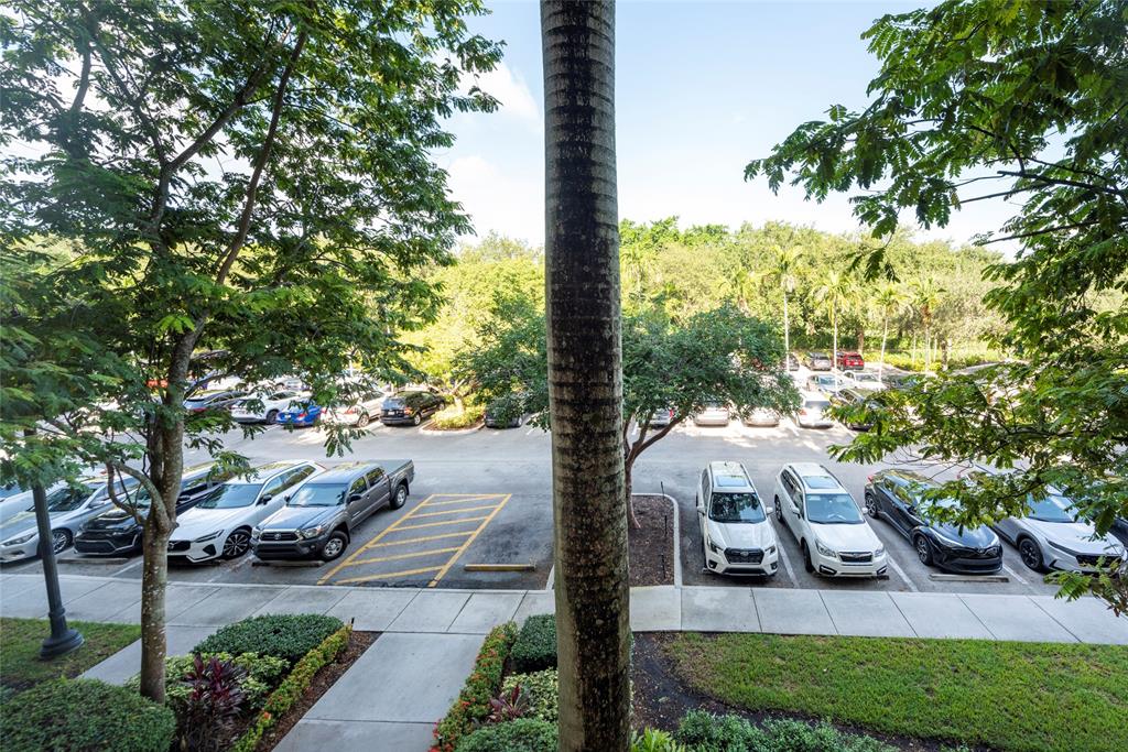 16102 Emerald Estates Drive, Unit 207 Weston, FL 33331 - Photo 21 of 32 a view of a garden with lawn chairs