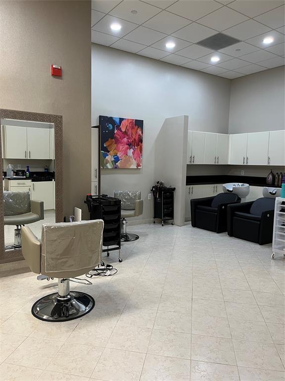 16102 Emerald Estates Drive, Unit 207 Weston, FL 33331 - Photo 28 of 32 a living room with furniture and a flat screen tv