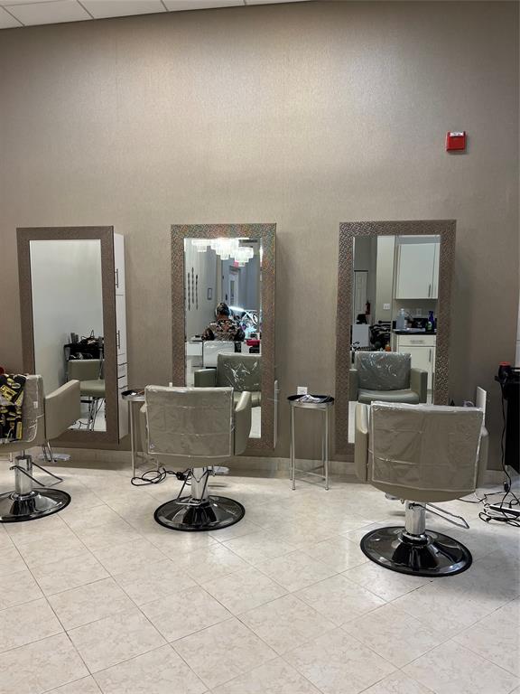 16102 Emerald Estates Drive, Unit 207 Weston, FL 33331 - Photo 29 of 32 a room with a table and chairs