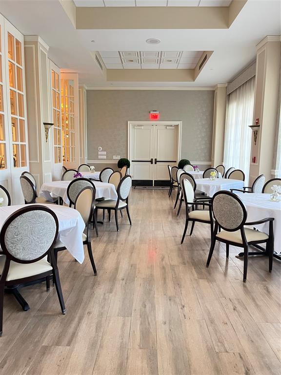 16102 Emerald Estates Drive, Unit 207 Weston, FL 33331 - Photo 30 of 32 a room with furniture pool table gym equipment wooden floor and windows