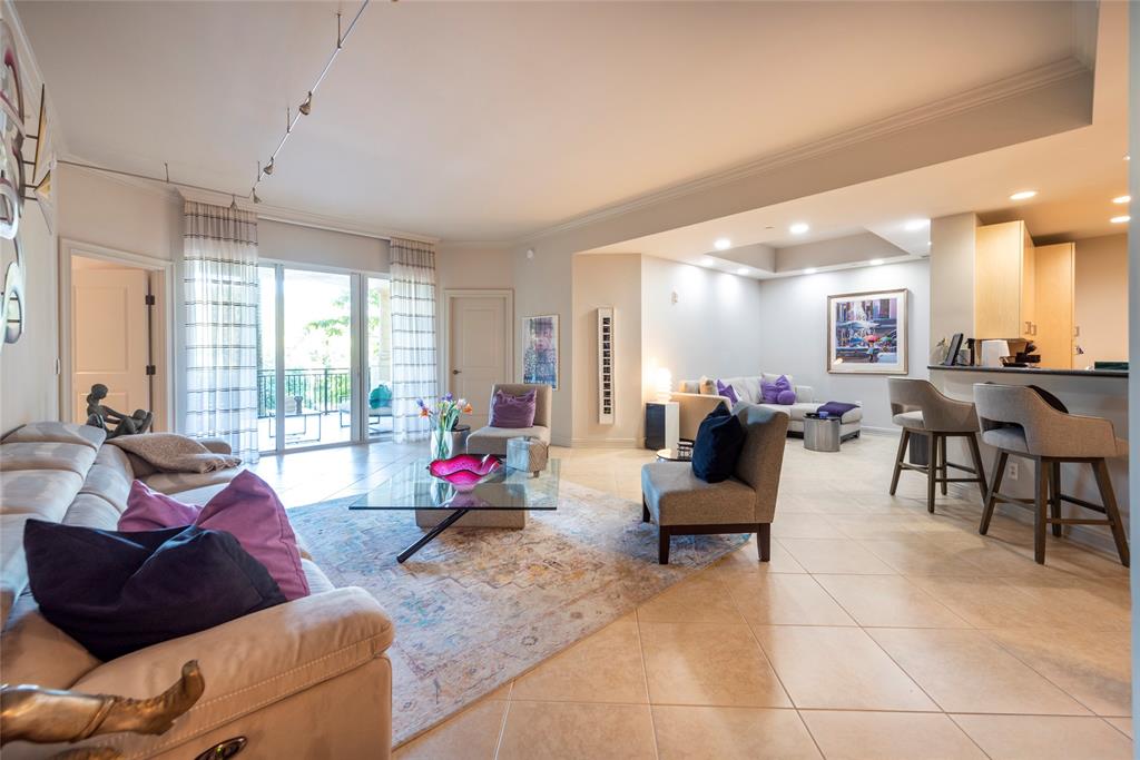 16102 Emerald Estates Drive, Unit 207 Weston, FL 33331 - Photo 8 of 32 a living room with furniture and a large window