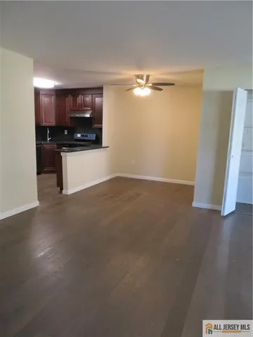 a view of a room with a flat screen tv