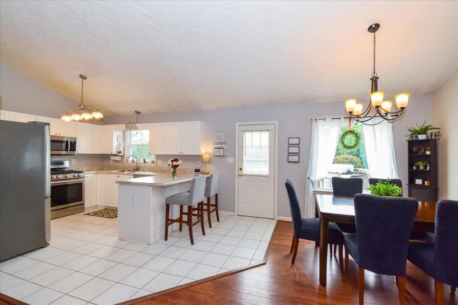1535 Mountain View Road Vinton, VA 24179 - Photo 5 of 20 a view of a dining room with furniture window and wooden floor