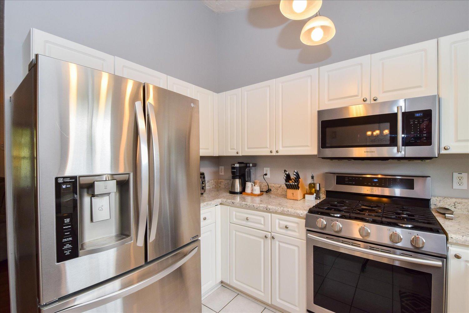 1535 Mountain View Road Vinton, VA 24179 - Photo 7 of 20 a kitchen with stainless steel appliances granite countertop a refrigerator a stove and a microwave